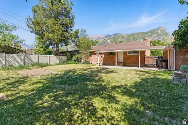 3025 N 250 E, Provo, UT 84604 - rear view of house with a mountain view, a chimney, and a patio