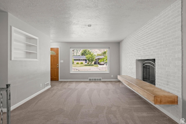 3025 N 250 E, Provo, UT 84604 - unfurnished living room with carpet, a textured ceiling, a fireplace, baseboards, and built in features