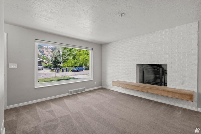 3025 N 250 E, Provo, UT 84604 - unfurnished living room with a textured ceiling, carpet flooring, a brick fireplace, and baseboards