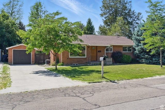 3025 N 250 E, Provo, UT 84604 - ranch-style house featuring brick siding, concrete driveway, a front yard, and an outdoor structure