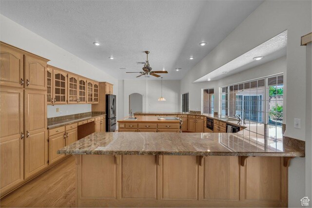 3350 S Fairway Rd, St George, UT 84790 - kitchen with refrigerator with ice dispenser, a kitchen breakfast bar, recessed lighting, a ceiling fan, and light wood-type flooring