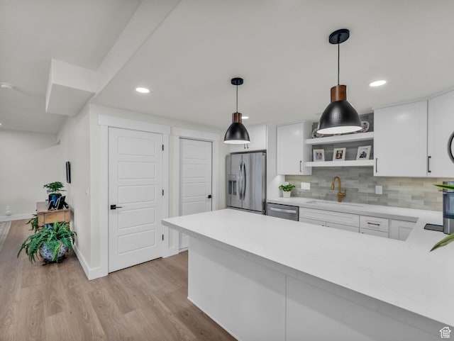 569 W Cascade Loop, Midway, UT 84049 - kitchen featuring stainless steel appliances, a sink, open shelves, light countertops, and white cabinets