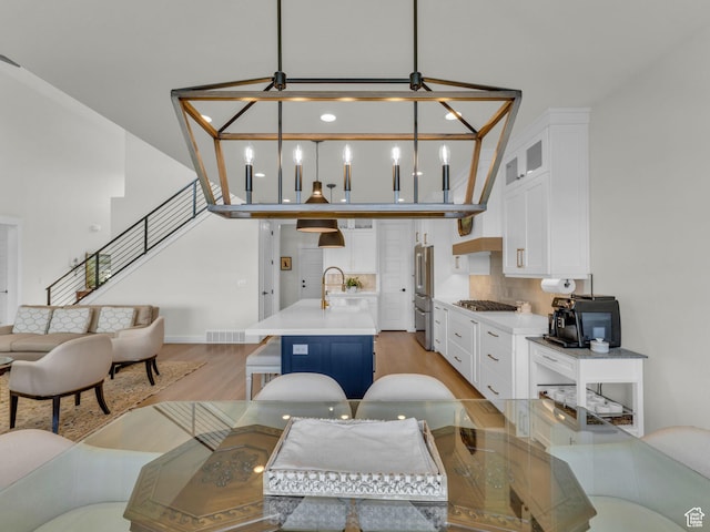 569 W Cascade Loop, Midway, UT 84049 - living area featuring light wood-style flooring and stairway