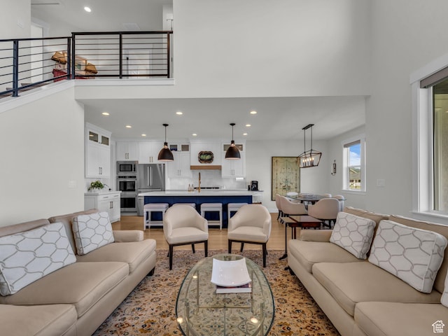 569 W Cascade Loop, Midway, UT 84049 - living area with a towering ceiling, light wood-type flooring, and recessed lighting