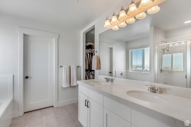 753 N Stallion Dr Unit 601, Spanish Fork, UT 84660 - bathroom with a shower stall, double vanity, tile patterned flooring, a walk in closet, and a bath