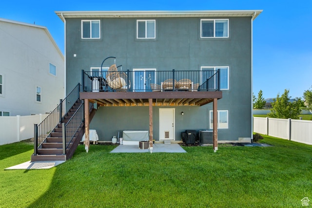 753 N Stallion Dr Unit 601, Spanish Fork, UT 84660 - rear view of property with stucco siding, a deck, a patio area, and central AC