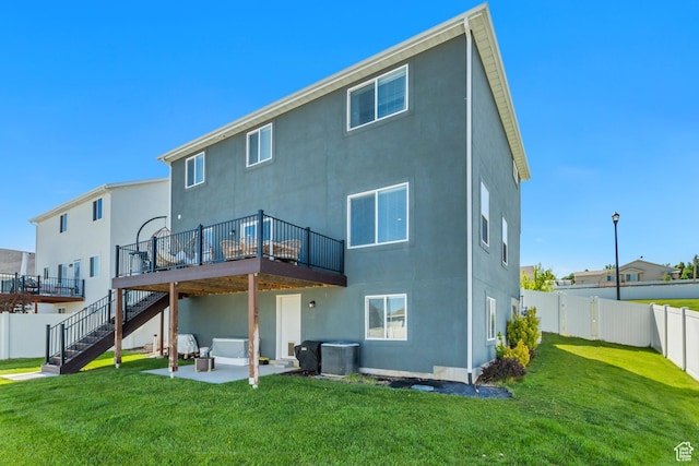753 N Stallion Dr Unit 601, Spanish Fork, UT 84660 - rear view of house with stucco siding, a wooden deck, stairway, and a patio area