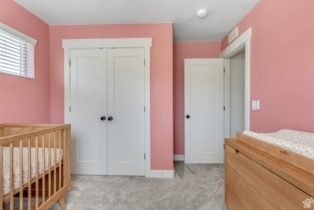 753 N Stallion Dr Unit 601, Spanish Fork, UT 84660 - bedroom featuring a closet, light carpet, baseboards, and a crib