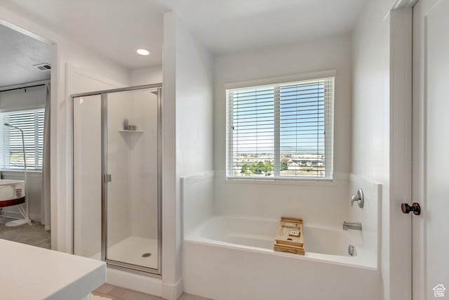 753 N Stallion Dr Unit 601, Spanish Fork, UT 84660 - full bath with a garden tub, a stall shower, plenty of natural light, and recessed lighting