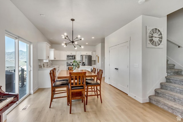 753 N Stallion Dr Unit 601, Spanish Fork, UT 84660 - dining area featuring a chandelier, stairway, light wood-style flooring, baseboards, and recessed lighting