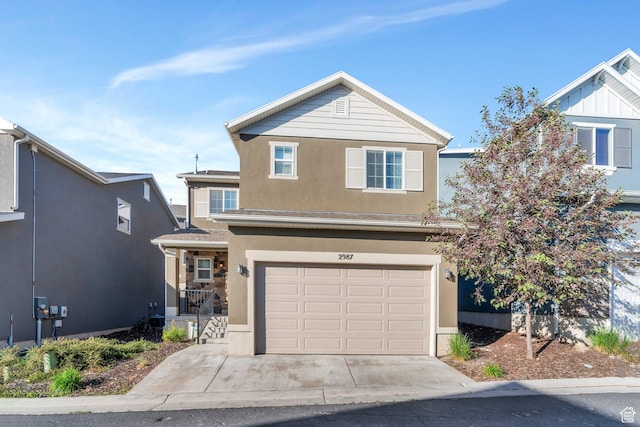 2987 S Willow Creek Dr, Saratoga Springs, UT 84045 - traditional-style home featuring stucco siding, a garage, and driveway
