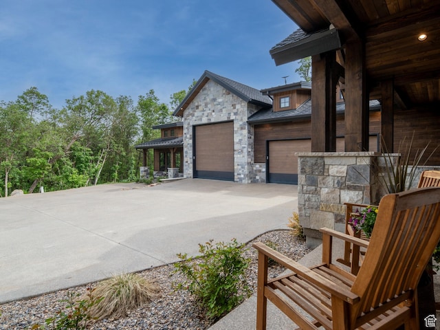 1156 N Valley View Dr, Eden, UT 84310 - view of home's exterior with stone siding and concrete driveway
