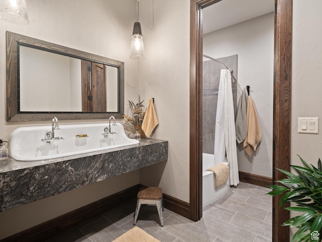 1156 N Valley View Dr, Eden, UT 84310 - full bathroom featuring shower / tub combo, tile patterned floors, baseboards, and a sink