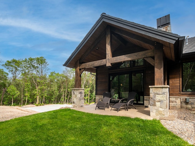 1156 N Valley View Dr, Eden, UT 84310 - rear view of house with a chimney and a lawn