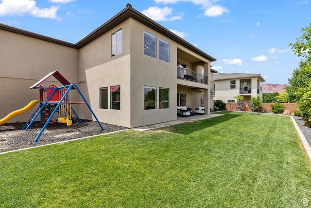 1432 Boys Pond Cir, Santa Clara, UT 84765 - rear view of property featuring a playground, stucco siding, a balcony, and a patio
