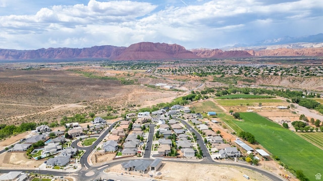 1432 Boys Pond Cir, Santa Clara, UT 84765 - aerial overview of property's location featuring a mountain backdrop and nearby suburban area