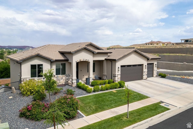 1432 Boys Pond Cir, Santa Clara, UT 84765 - view of front of house with stone siding, a garage, stucco siding, and driveway