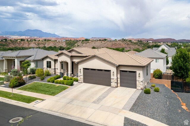 1432 Boys Pond Cir, Santa Clara, UT 84765 - view of front of house featuring a garage, stucco siding, concrete driveway, a mountain view, and a tile roof