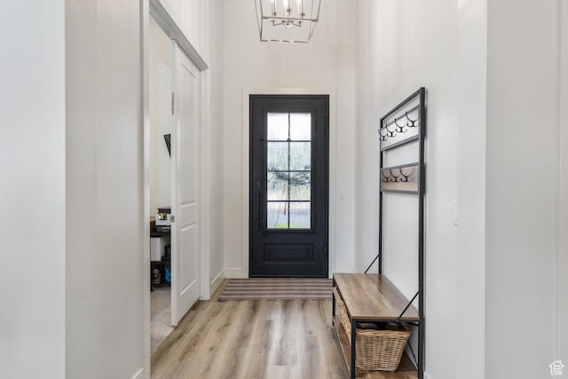 1432 Boys Pond Cir, Santa Clara, UT 84765 - entryway with light wood finished floors, a chandelier, and baseboards