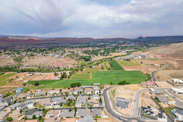 1432 Boys Pond Cir, Santa Clara, UT 84765 - aerial overview of property's location with a mountainous background and nearby suburban area