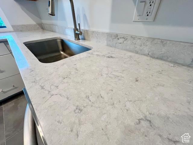 4969 S Eastridge Ln E Unit 174, Salt Lake City, UT 84117 - kitchen view of a sink and light stone countertops