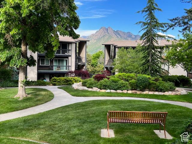 4969 S Eastridge Ln E Unit 174, Salt Lake City, UT 84117 - view of home's community with a yard and a mountain view