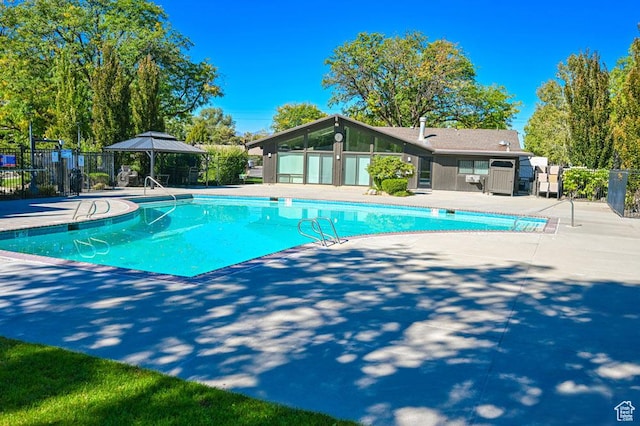 4969 S Eastridge Ln E Unit 174, Salt Lake City, UT 84117 - community pool featuring a patio and a gazebo