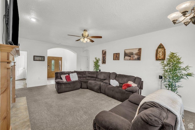 1165 W Indian Hills Dr Unit 236, St George, UT 84770 - living area featuring arched walkways, carpet floors, ceiling fan, a textured ceiling, and a chandelier
