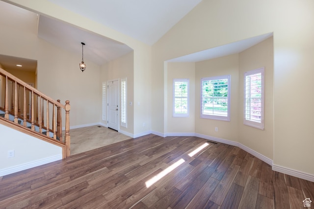 407 E Clay Ln, Lehi, UT 84043 - entrance foyer with wood finished floors, stairs, high vaulted ceiling, and baseboards