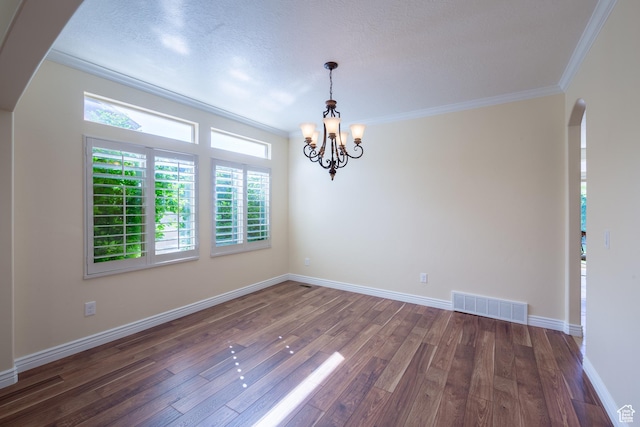 407 E Clay Ln, Lehi, UT 84043 - empty room featuring arched walkways, crown molding, wood finished floors, a chandelier, and plenty of natural light