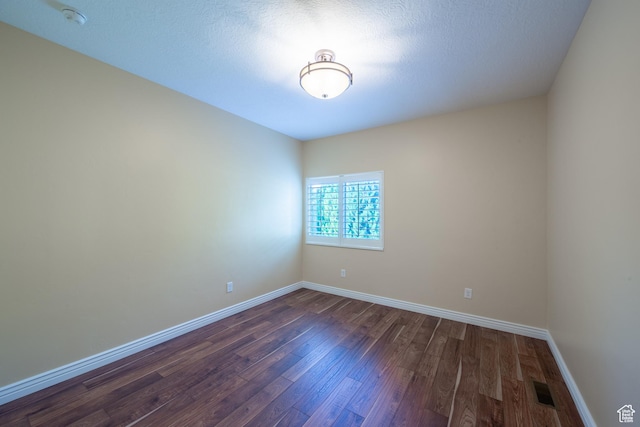 407 E Clay Ln, Lehi, UT 84043 - empty room with dark wood-style floors, a smoke detector, and baseboards