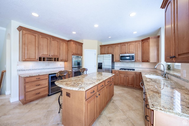 407 E Clay Ln, Lehi, UT 84043 - kitchen with stainless steel appliances, a sink, wine cooler, a kitchen island, and light stone counters