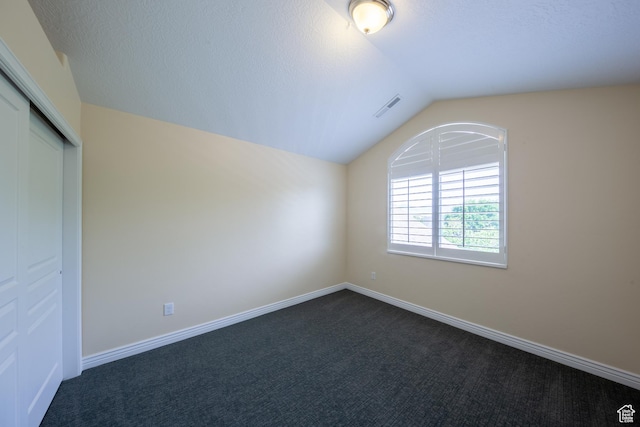 407 E Clay Ln, Lehi, UT 84043 - unfurnished bedroom with lofted ceiling, dark carpet, a closet, and baseboards