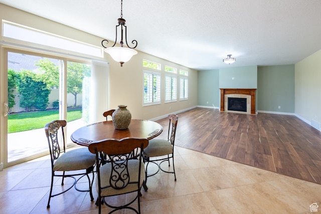 407 E Clay Ln, Lehi, UT 84043 - tiled dining area with a tiled fireplace and baseboards