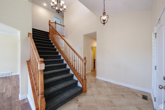 407 E Clay Ln, Lehi, UT 84043 - staircase featuring a chandelier, baseboards, and a high ceiling