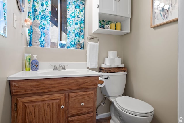 5063 W Milstead Ln, Kearns, UT 84118 - bathroom featuring toilet, vanity, and baseboards