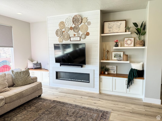 5893 S Kastra Ln, St George, UT 84790 - living room with light wood finished floors, a large fireplace, and recessed lighting