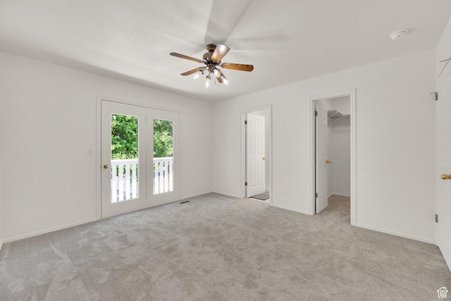 1261 E Hillsden Rd N, Layton, UT 84040 - unfurnished bedroom featuring access to outside, carpet, a walk in closet, a ceiling fan, and baseboards