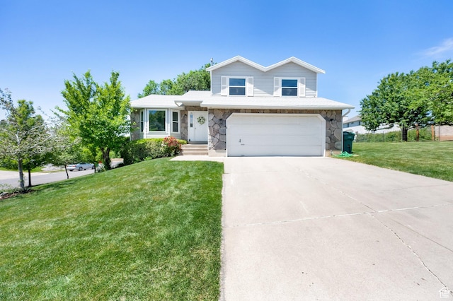 1261 E Hillsden Rd N, Layton, UT 84040 - tri-level home featuring a garage, stone siding, driveway, and a front yard