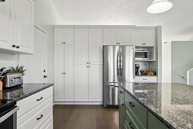 324 W 1650 N, Cedar City, UT 84721 - kitchen featuring stainless steel appliances, dark wood finished floors, dark stone counters, and white cabinets