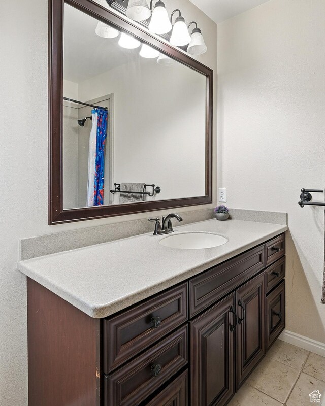 324 W 1650 N, Cedar City, UT 84721 - full bathroom featuring vanity, baseboards, a shower with curtain, and tile patterned flooring