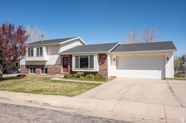 324 W 1650 N, Cedar City, UT 84721 - split level home featuring a garage, brick siding, a front yard, and driveway