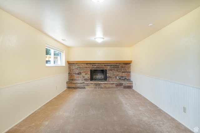 557 N 1160 E, Orem, UT 84097 - unfurnished living room featuring a stone fireplace, wainscoting, and carpet floors