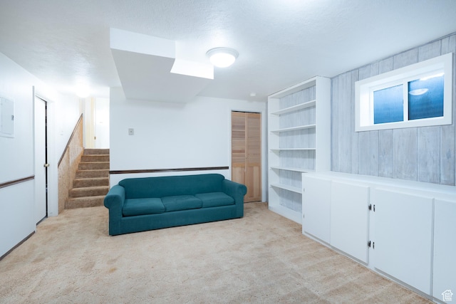 557 N 1160 E, Orem, UT 84097 - living area with light colored carpet, stairs, and electric panel
