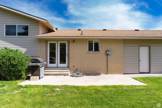 557 N 1160 E, Orem, UT 84097 - back of house featuring brick siding, entry steps, a yard, and a patio