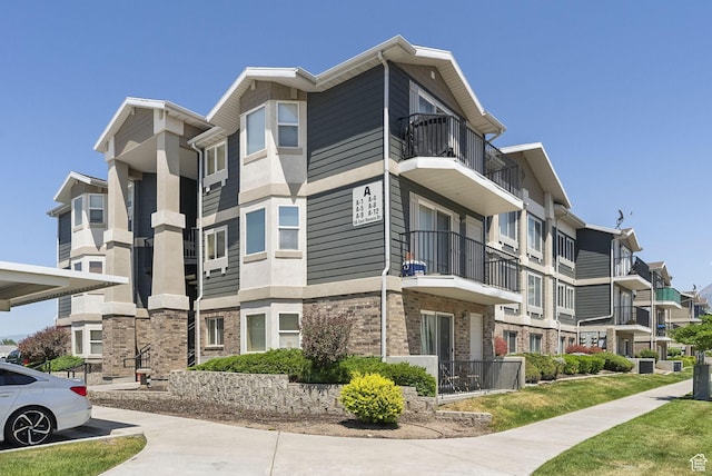 56 E Resaca Dr Unit A-12, Sandy, UT 84070 - view of building exterior with a residential view