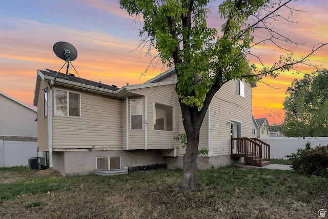 3388 W Briar Dr S, West Jordan, UT 84084 - back of house at dusk with central air condition unit
