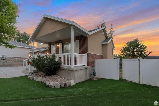 3388 W Briar Dr S, West Jordan, UT 84084 - view of front of house featuring brick siding and covered porch