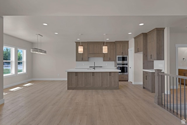 4594 S 6300 W, Hooper, UT 84315 - kitchen with appliances with stainless steel finishes, light countertops, baseboards, light wood-type flooring, and recessed lighting