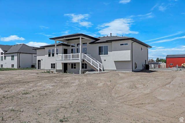 4594 S 6300 W, Hooper, UT 84315 - rear view of house featuring central AC, stucco siding, and stairs